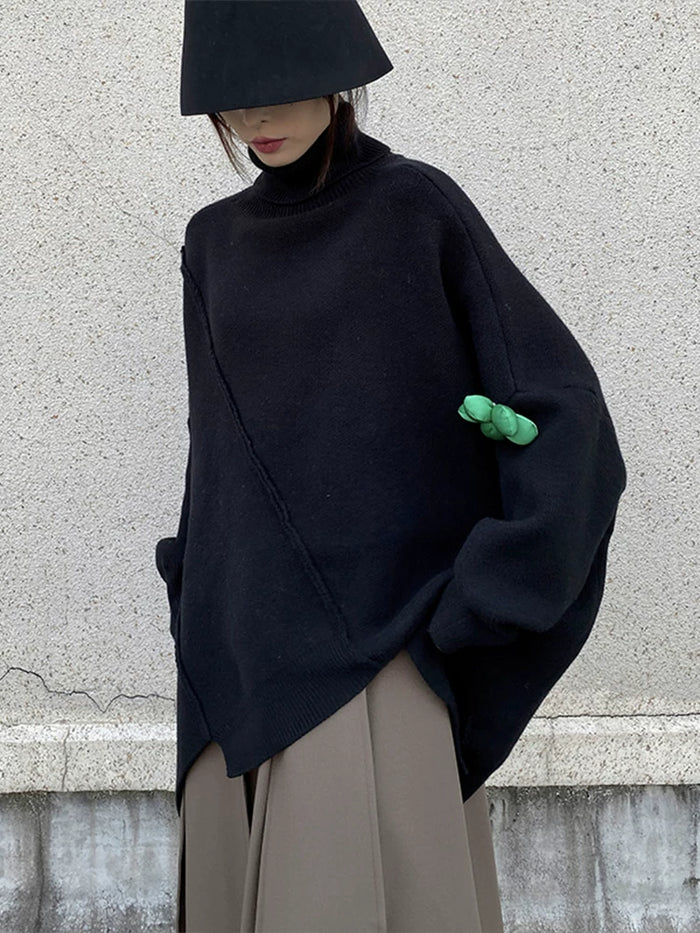 ブラックのアシンメトリー ハイネックニット 着用 バストアップ