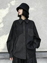 ブラックのチェック柄シャツ 着用 斜め ボリュームのある袖