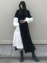 ブラックのアシンメトリー ニット 着用 全身 ブーツ合わせ